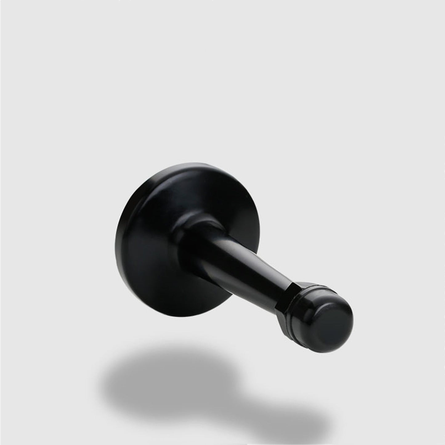The Heavyweight Wall-Mounted Door Stop — Matte Black