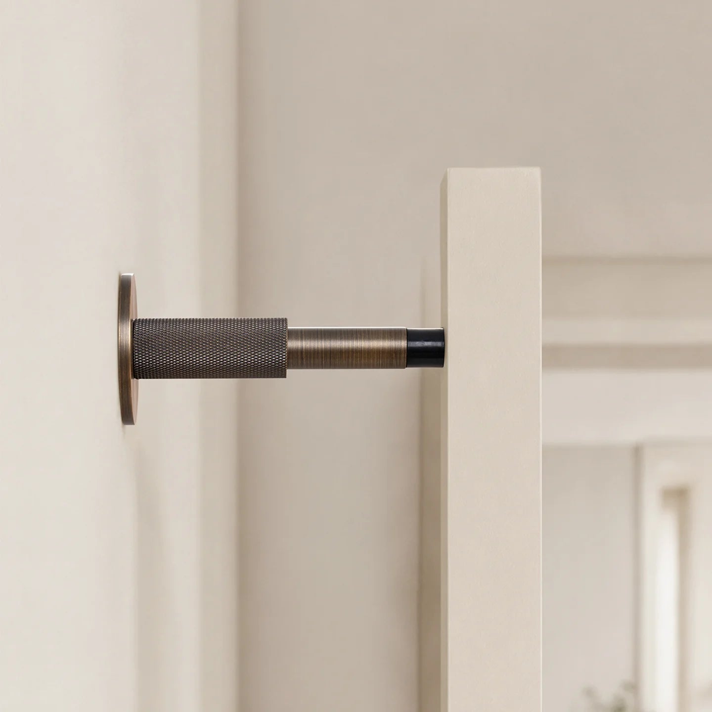 The Knurled Adjustable Floor & Wall Door Stop — Brushed Brass